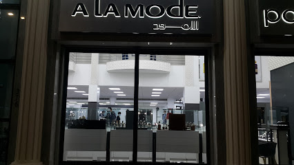 ملابس شريف - مدخل المعرض - المحرق - +973 1774 8998